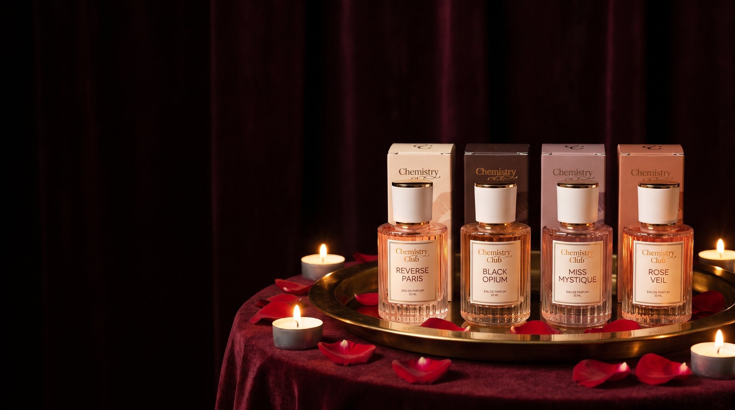 The four Chemistry Scent perfumes on oxblood velvet